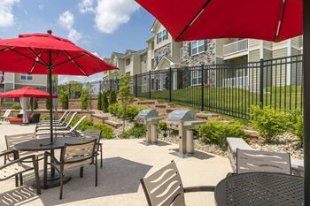 Poolside dining patio with gas grills